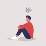 Bir kişi, öfkesini sağlıklı bir şekilde ifade etmek için derin nefes alıyor ve sakinleşmeye çalışıyor.